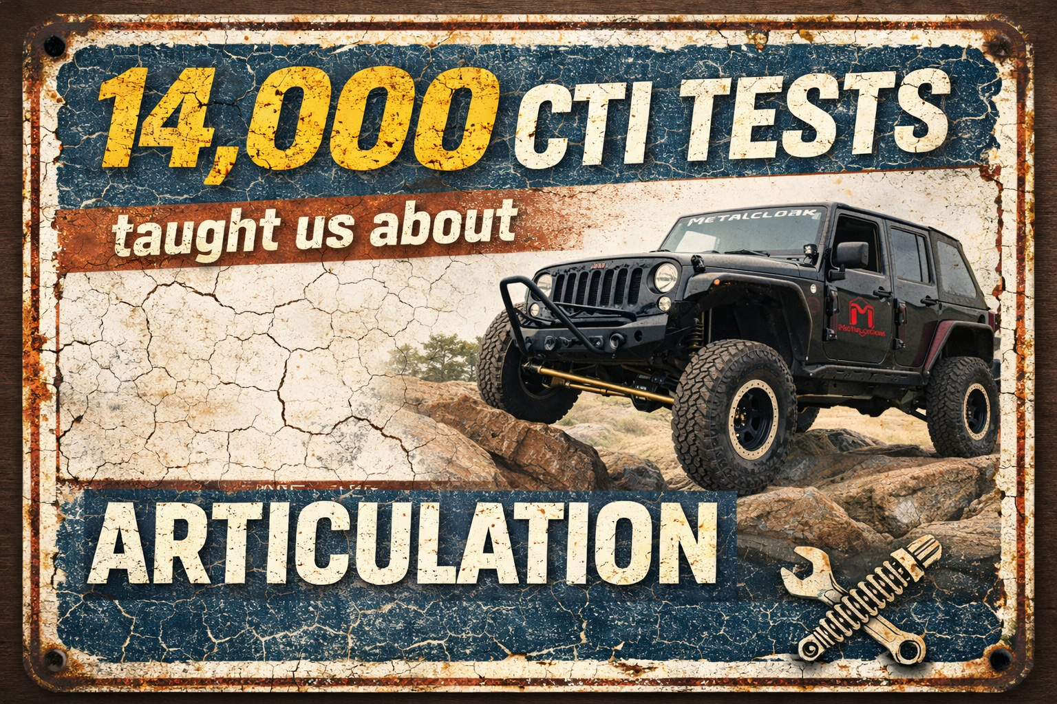 Black MetalCloak Jeep Wrangler JK articulating over rocks showing real suspension flex and traction control