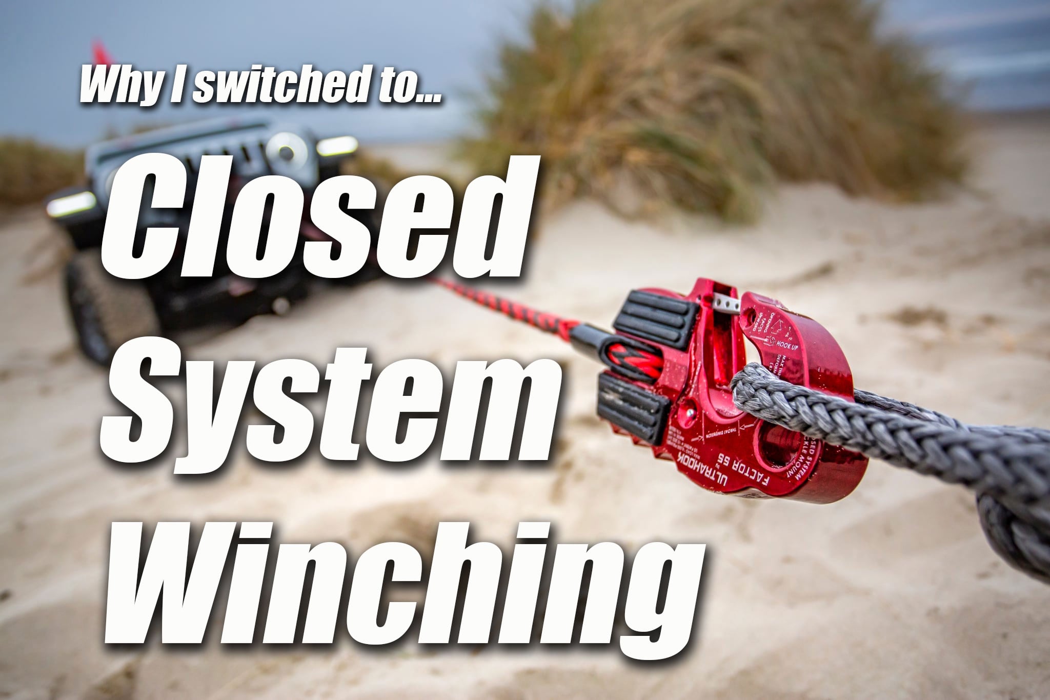 Image of Factor55 Ultrahook soft shackle on beach with Jeep in recovery