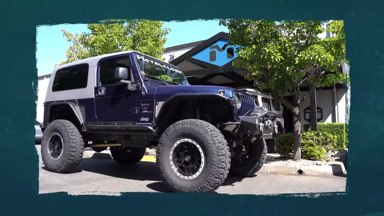 jeep lj wrangler parked in front of MetalCloak, rubicon express long arm bolt in upgrade kit