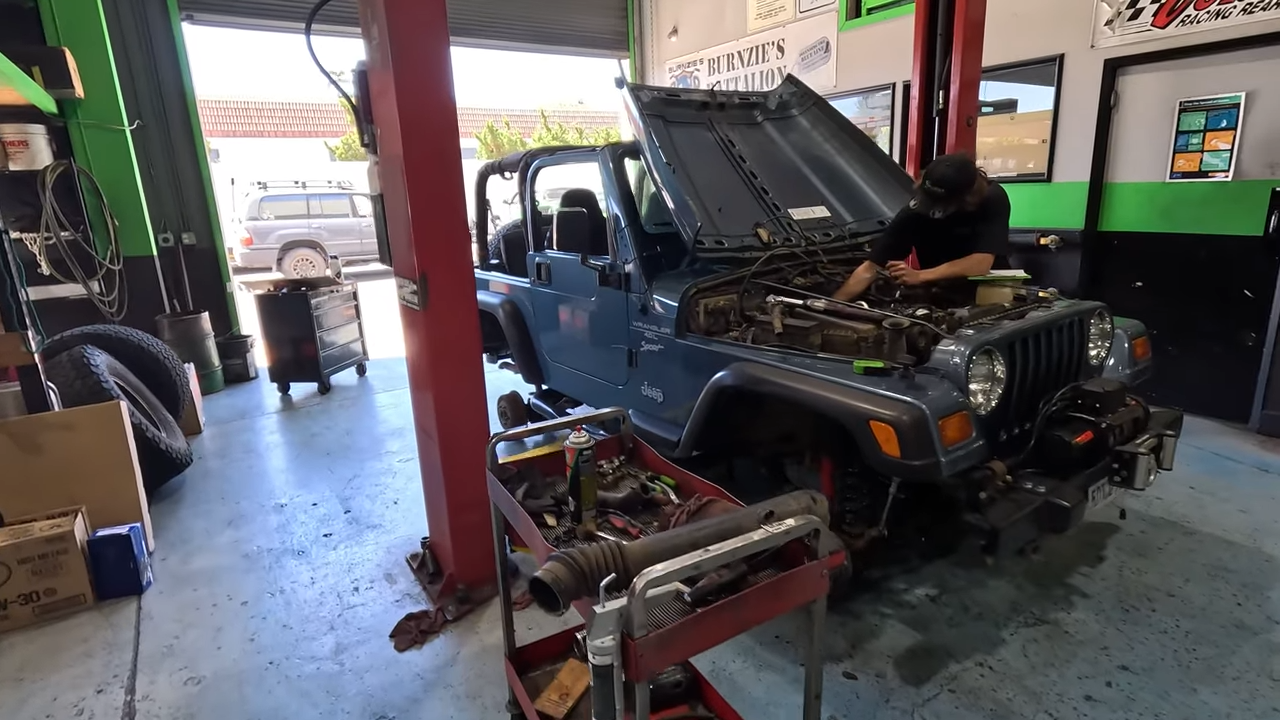 metalcloak rigs and wrenches arabia's overkill, Jeep TJ Wrangler, suspension cooling system valve cover leak installation
