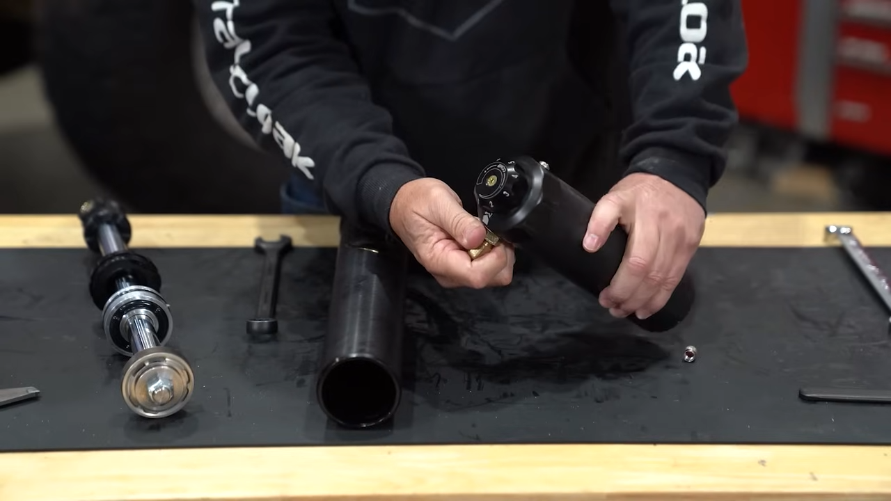 metalcloak rocksport black shock reservoir, orb fittings allow to rotate and position reservoir for your setup