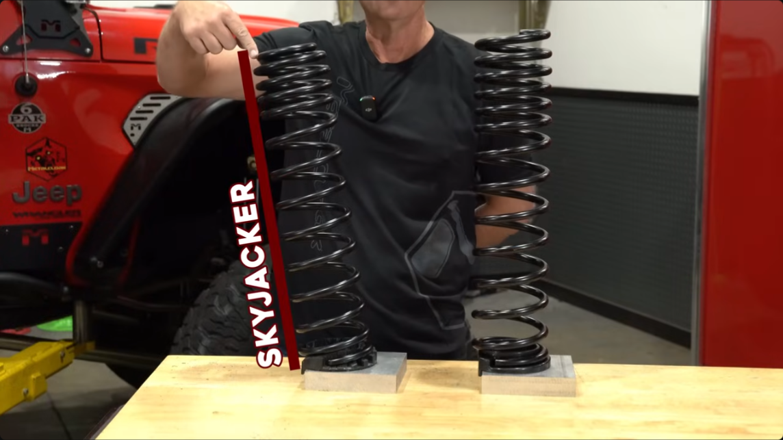 skyjacker jeep suspension spring uses factory coil isolator, does not sit straight on factory isolator creating bind/ buckle in spring when loaded