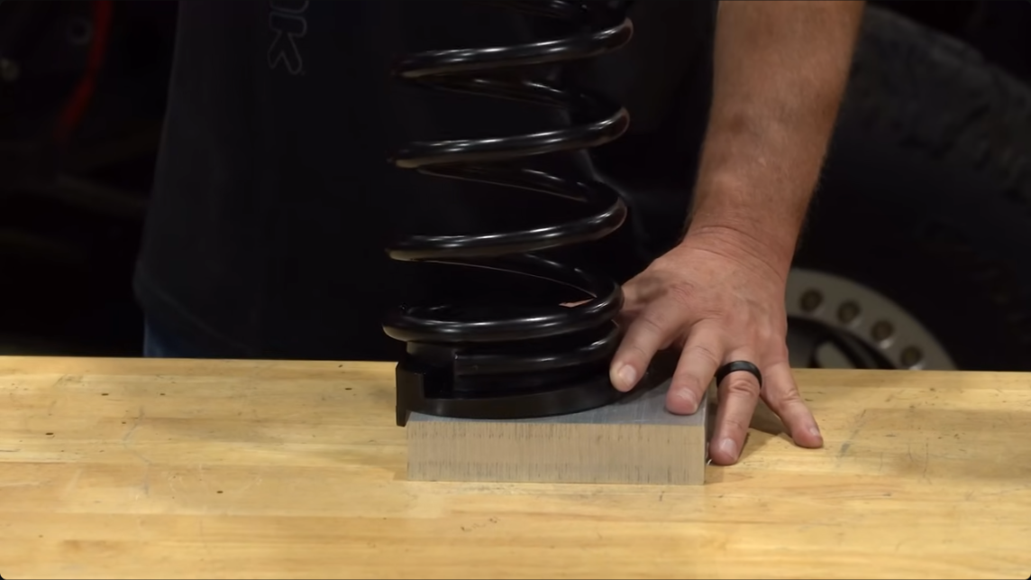 rock krawler coil not mated to coil spring isolator allowing coil to rock, identical isolator to metalcloak design, true dual rate coils fit perfectly on rock krawler isolator, 